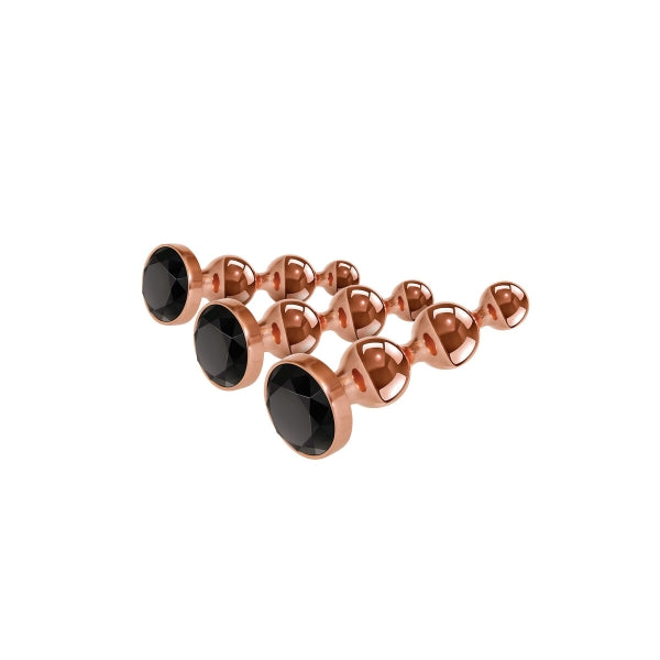 Conjunto de plugs anais Gold Digger com três tamanhos, design esférico, liga de alumínio compatível com variações térmicas e base com joia preta brilhante.