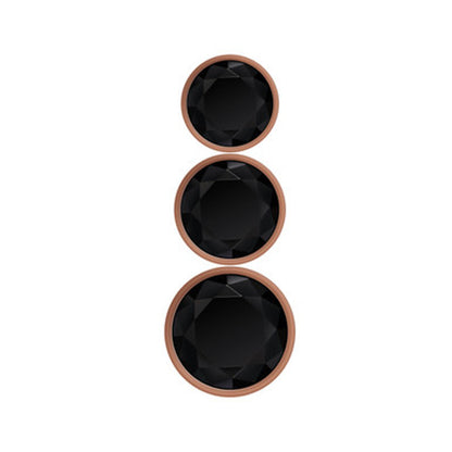 Conjunto de plugs anais Gold Digger com três tamanhos, design esférico, liga de alumínio compatível com variações térmicas e base com joia preta brilhante.